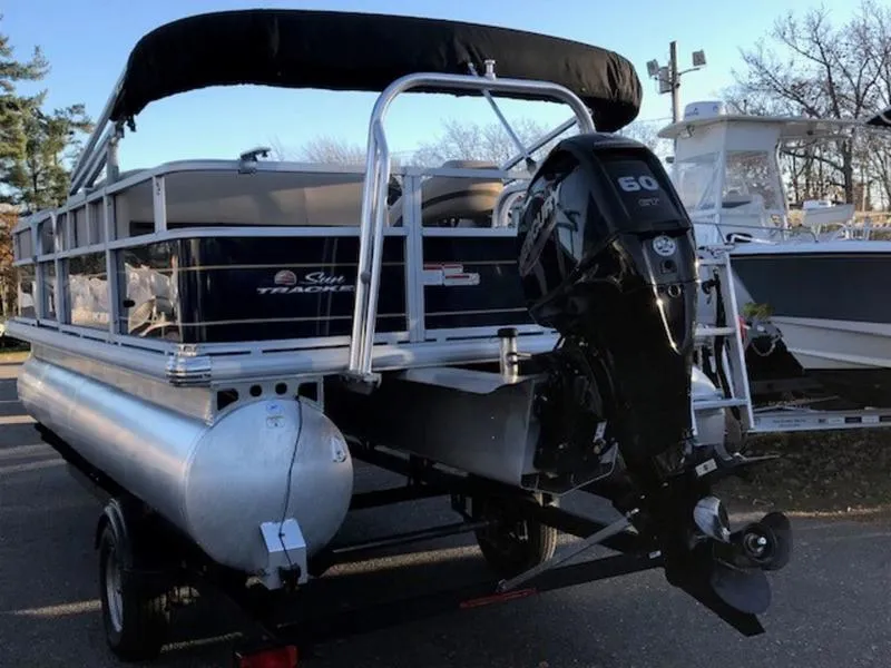 Slide: The Image of 2022 Sun Tracker PB 18 DLX pontoon boat with 60 HP engine on trailer. - 3