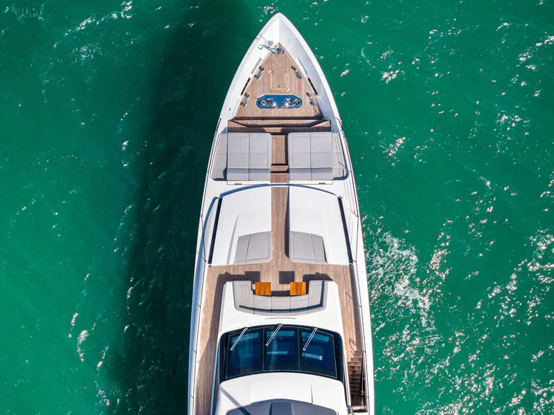Slide: The Image of Aerial view of 2022 Custom Line 106 yacht on turquoise water. - 11