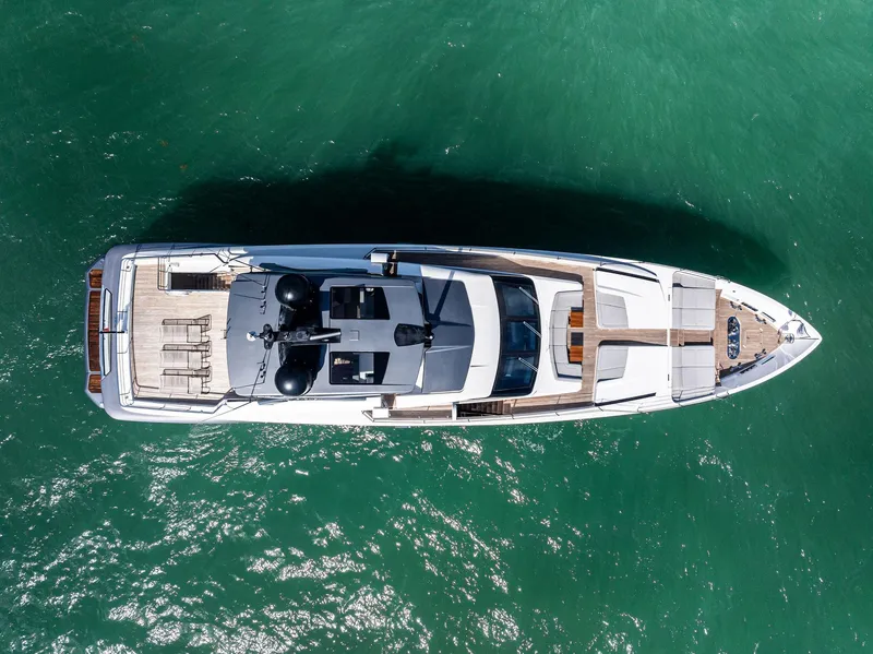 Slide: The Image of Aerial view of 2022 Custom Line 106 yacht on turquoise water. - 12