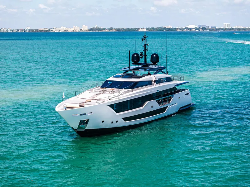 Slide: The Image of Luxurious 2022 Custom Line 106 yacht cruising in clear blue waters. - 15