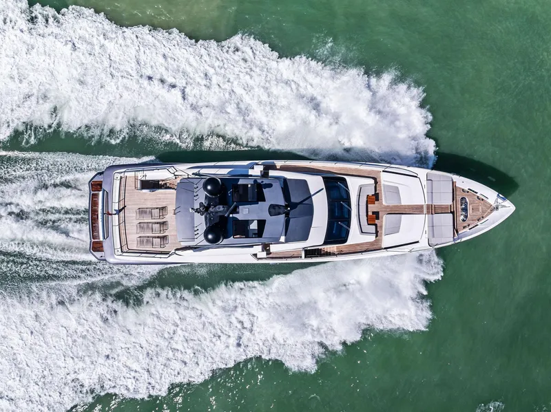 Slide: The Image of Aerial view of 2022 Custom Line 106 yacht cruising on the ocean. - 19