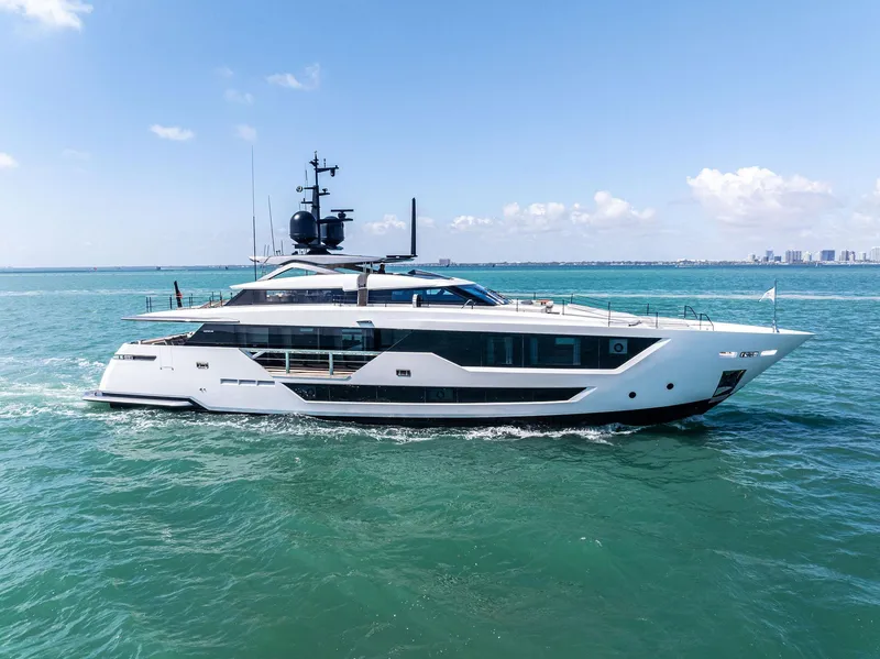 Slide: The Image of Luxurious 2022 Custom Line 106 yacht cruising on clear blue waters. - 2