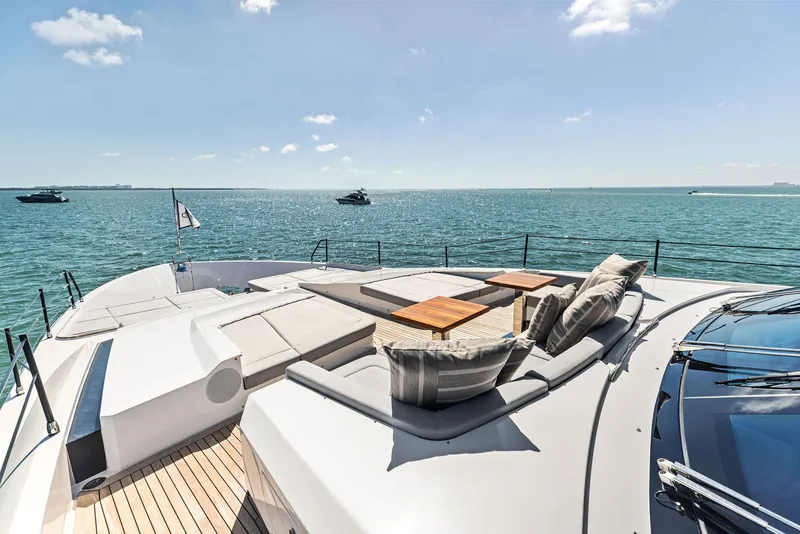 Slide: The Image of Luxury yacht Custom Line 106, 2022 model, with sun deck and ocean view. - 22