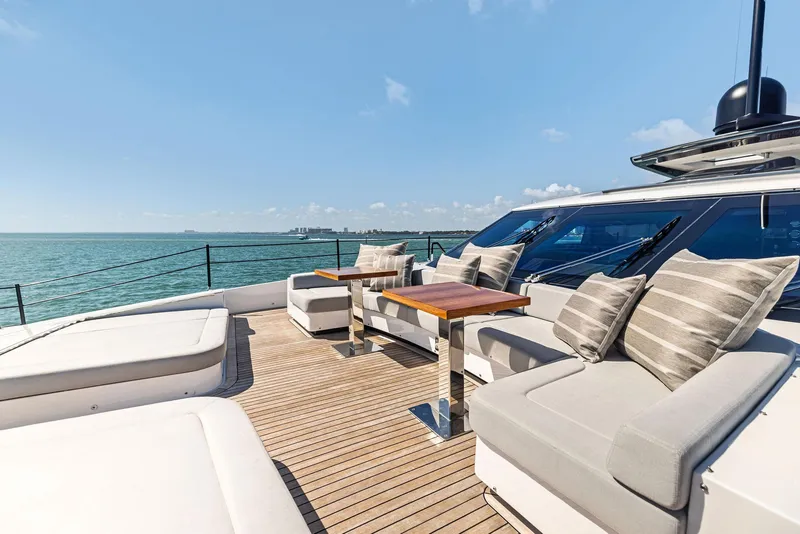 Slide: The Image of Luxurious 2022 Custom Line 106 yacht deck with elegant seating and ocean view. - 23