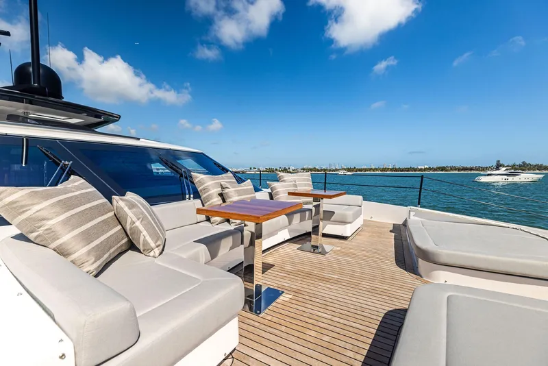 Slide: The Image of Luxurious 2022 Custom Line 106 yacht deck with elegant seating and ocean view. - 24