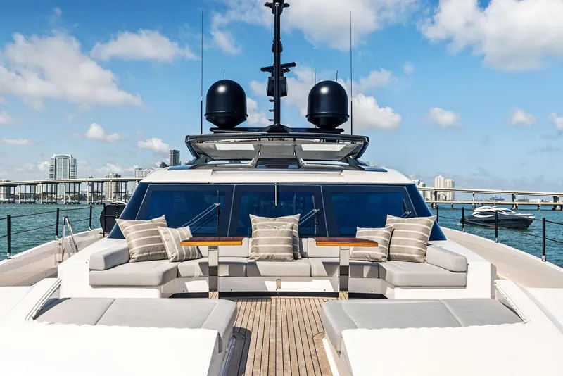 Slide: The Image of Luxurious 2022 Custom Line 106 yacht with elegant outdoor seating and ocean view. - 25