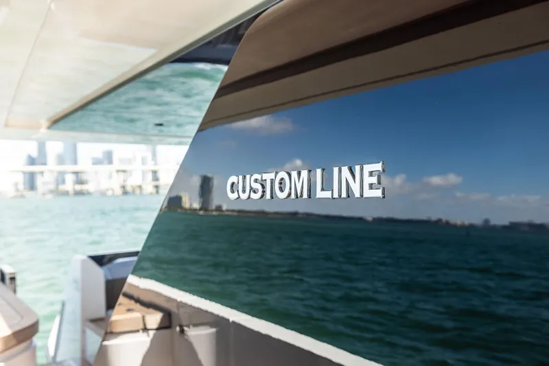 Slide: The Image of 2022 Custom Line 106 yacht reflecting ocean and city skyline. - 31