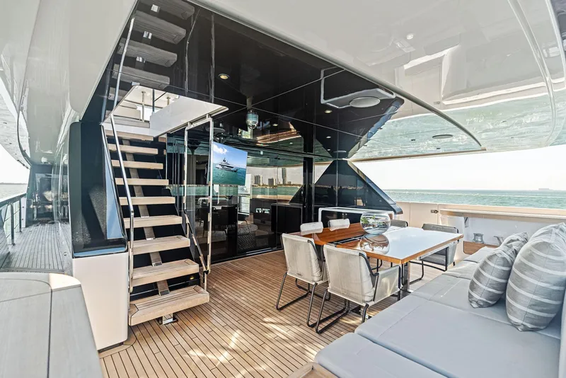Slide: The Image of Luxurious 2022 Custom Line 106 yacht deck with elegant seating and ocean view. - 32