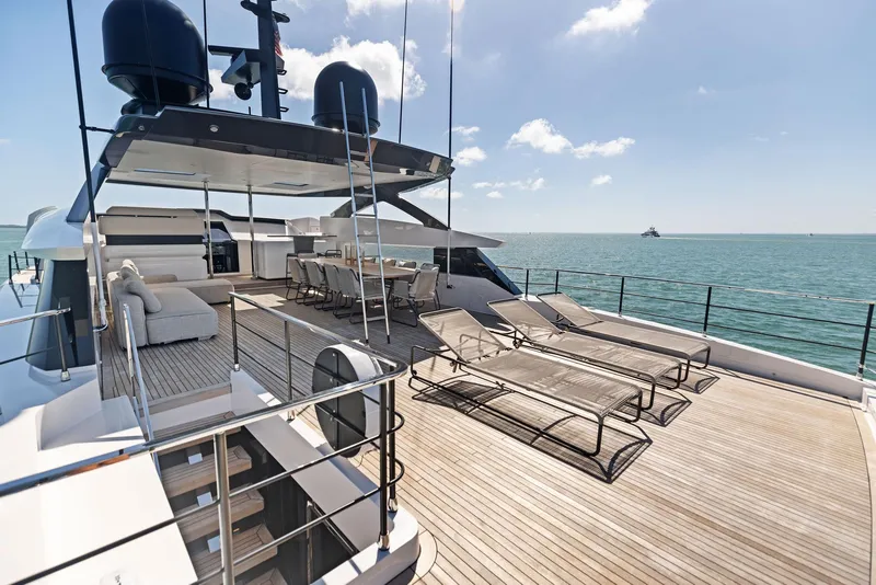 Slide: The Image of Luxurious 2022 Custom Line 106 yacht deck with sun loungers and ocean view. - 41