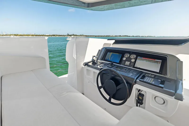 Slide: The Image of Luxurious helm of 2022 Custom Line 106 yacht with modern navigation equipment. - 44