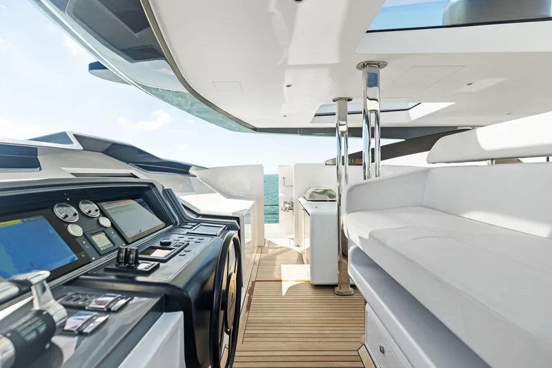 Slide: The Image of Luxurious 2022 Custom Line 106 yacht interior with modern helm and sleek seating. - 45