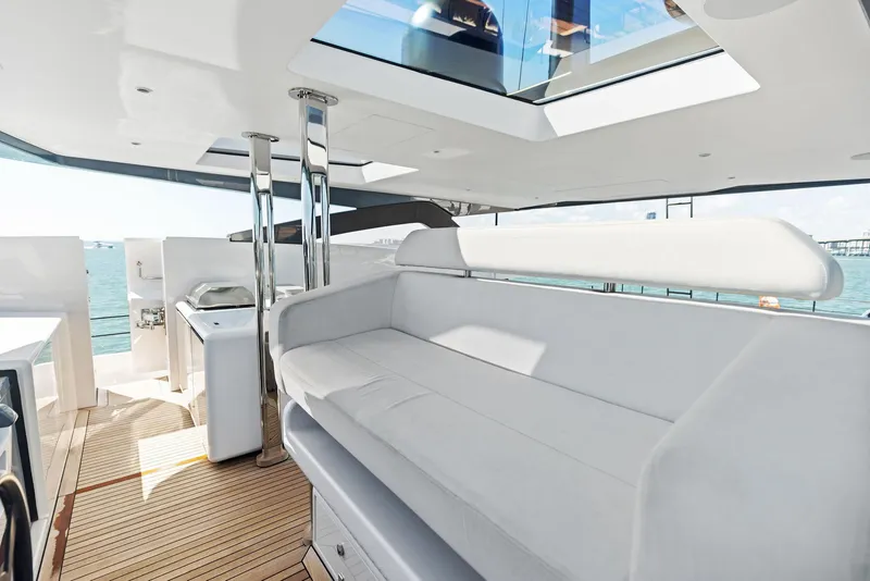 Slide: The Image of Luxurious 2022 Custom Line 106 yacht interior with sleek seating and ocean view. - 47