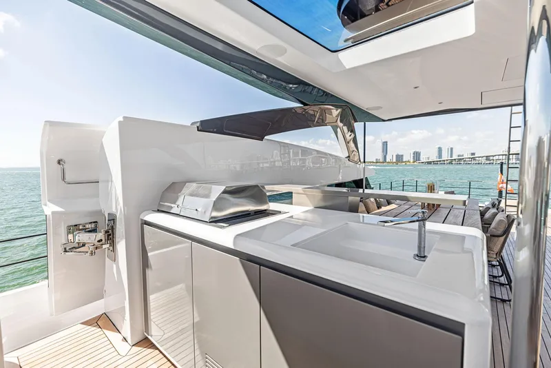 Slide: The Image of Luxurious 2022 Custom Line 106 yacht deck with modern outdoor kitchen and ocean view. - 49
