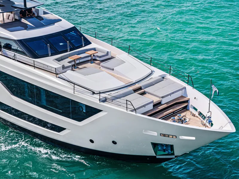 Slide: The Image of Luxurious 2022 Custom Line 106 yacht cruising on turquoise waters. - 8