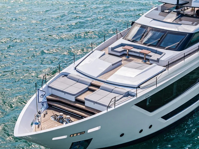 Slide: The Image of Luxurious 2022 Custom Line 106 yacht with spacious deck on serene blue waters. - 9