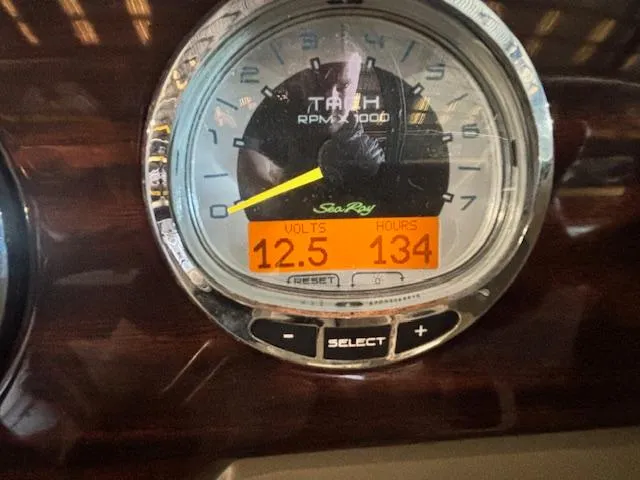 Slide: The Image of Tachometer of 2013 Sea Ray 220 Sundeck showing 12.5 volts and 134 hours. - 11