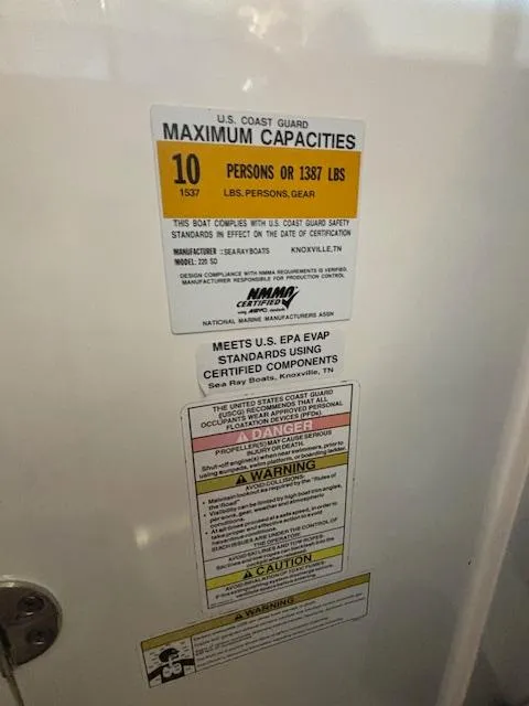 Slide: The Image of Capacity label on 2013 Sea Ray 220 Sundeck, maximum 10 persons or 1387 lbs. - 18