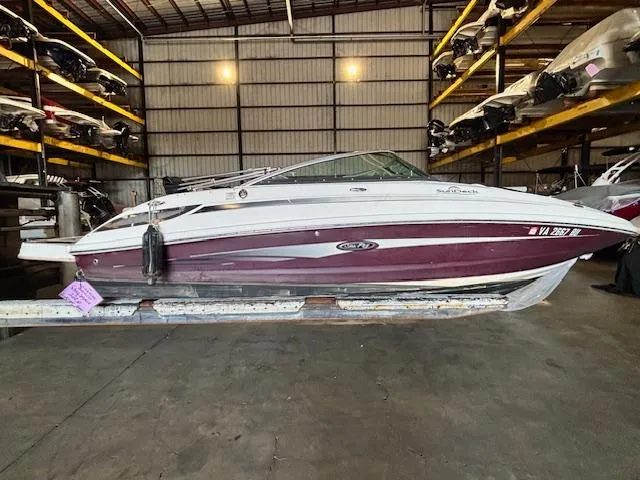The Image of 2013 Sea Ray 220 Sundeck boat in indoor storage facility. - 2