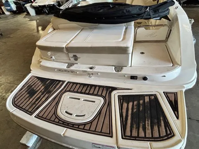Slide: The Image of 2013 Sea Ray 220 Sundeck boat with spacious rear deck and seating area. - 5