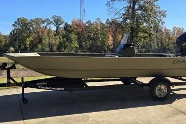 The Image of 2025 Tracker Grizzly 2072 CC boat on trailer, parked outdoors. - 0
