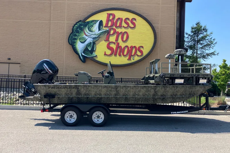 The Image of 2025 Tracker Grizzly 2072 CC Sportsman boat outside Bass Pro Shops store. - 0