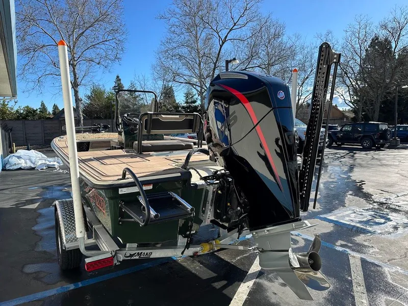 Slide: The Image of 2025 Mako 18 Pro Skiff Backwater Edition on trailer, parked outdoors. - 10