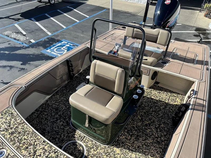 Slide: The Image of 2025 Mako 18 Pro Skiff Backwater Edition boat with camouflage interior and seating. - 17