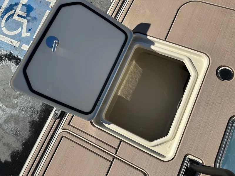Slide: The Image of Open storage compartment on 2025 Mako 18 Pro Skiff Backwater Edition boat. - 26