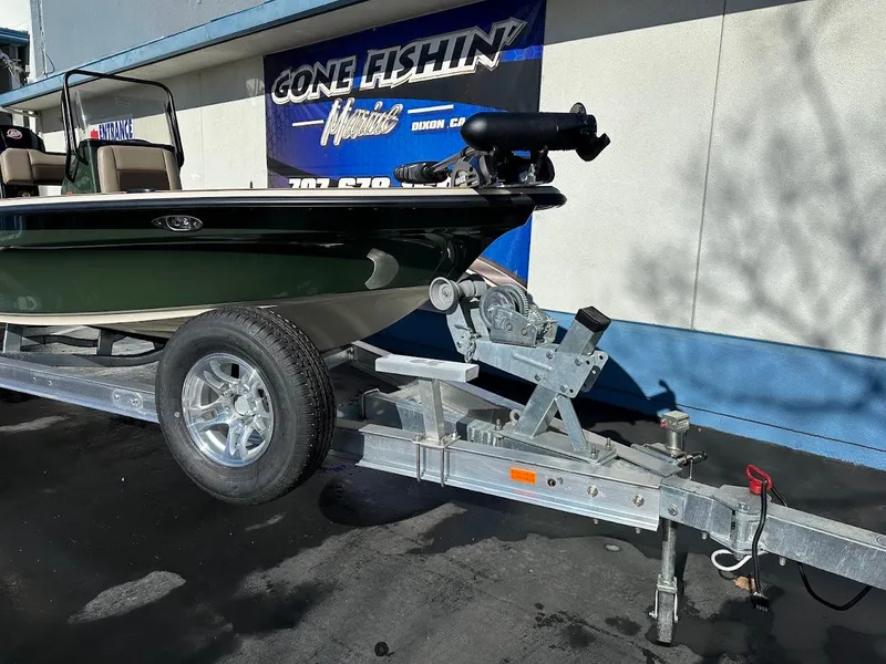 Slide: The Image of 2025 Mako 18 Pro Skiff Backwater Edition on trailer, displayed at dealership. - 4