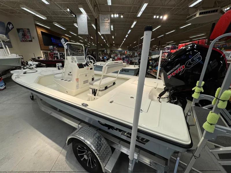 Slide: The Image of 2025 Mako 18 LTS boat displayed indoors with Mercury Pro XS engine. - 3