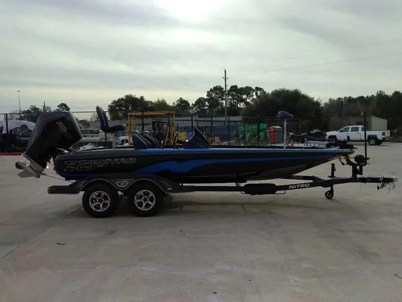 Slide: The Image of 2025 Nitro Z21 XL boat on trailer in outdoor setting. - 1