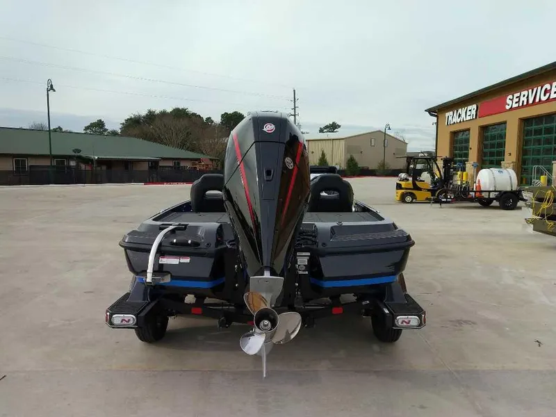 Slide: The Image of 2025 Nitro Z21 XL boat at service center, rear view. - 3