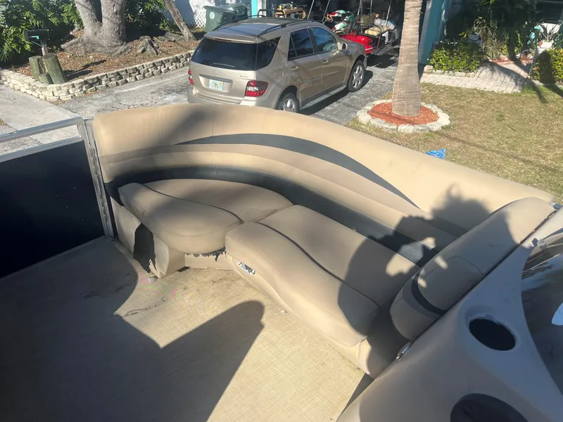 Slide: The Image of 2017 Crestliner 200 RALLY boat interior with beige seating and cup holders. - 4