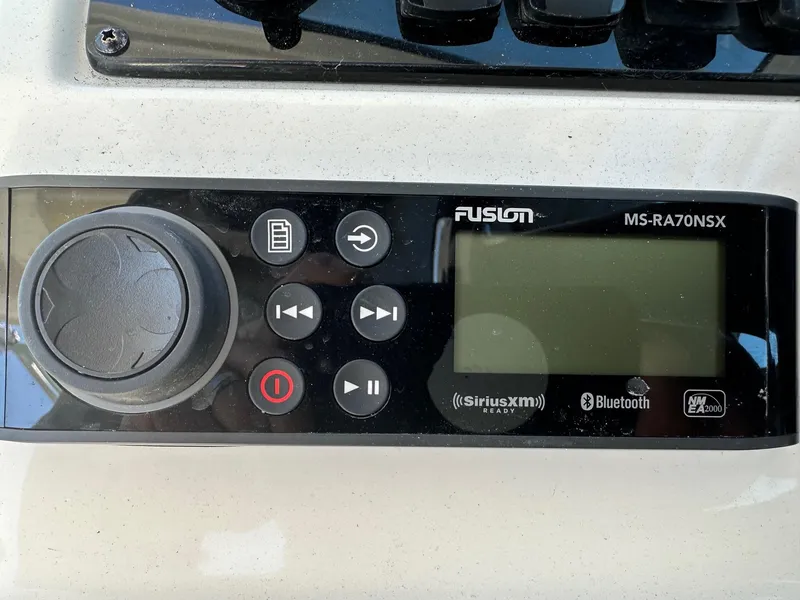 Slide: The Image of Fusion MS-RA70NSX marine stereo on 2023 Sailfish 245 DC boat dashboard. - 25