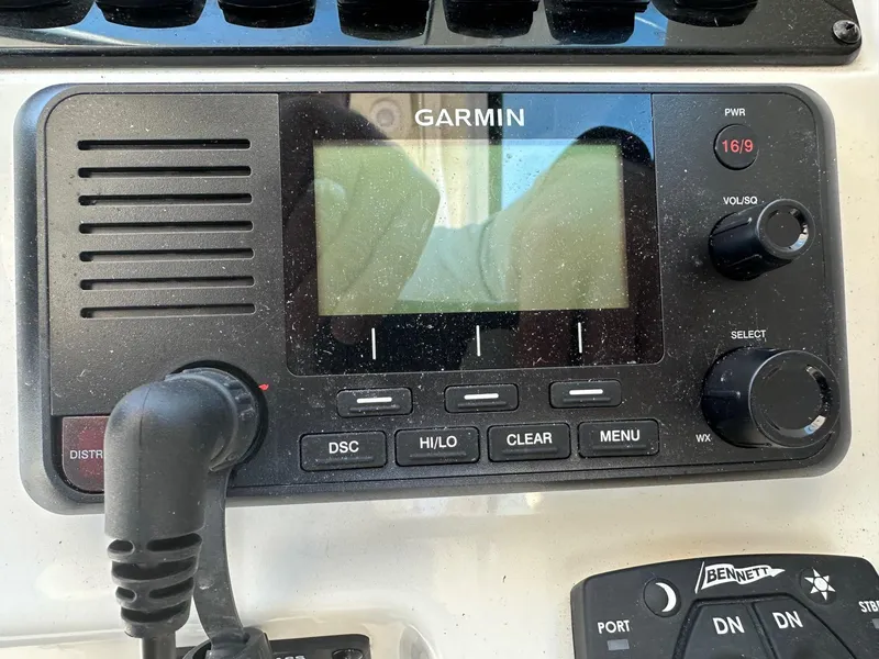 Slide: The Image of Garmin marine radio on 2023 Sailfish 245 DC boat dashboard. - 26