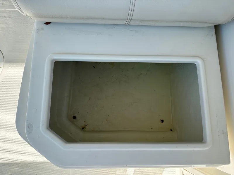 Slide: The Image of Open storage compartment on 2023 Sailfish 245 DC boat. - 37