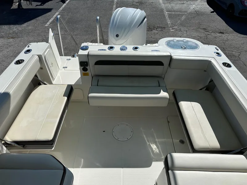 Slide: The Image of 2023 Sailfish 245 DC boat interior with cushioned seating and modern design. - 41