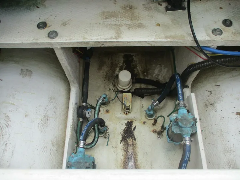 Slide: The Image of 2007 Silverton 33 Convertible engine compartment with hoses and fittings. - 17