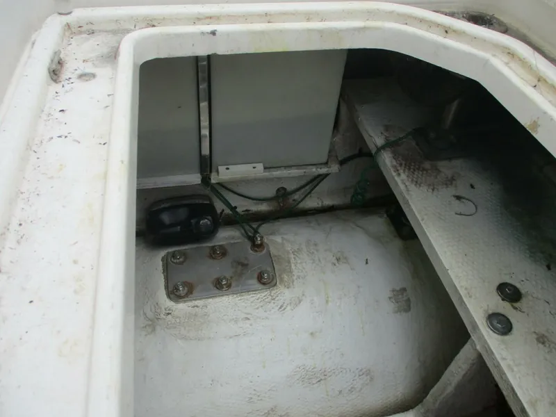 Slide: The Image of 2007 Silverton 33 Convertible boat interior compartment with visible wiring and components. - 21