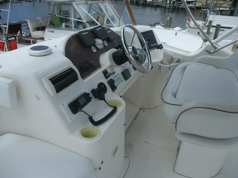 Slide: The Image of 2007 Silverton 33 Convertible boat helm with steering wheel and controls. - 24