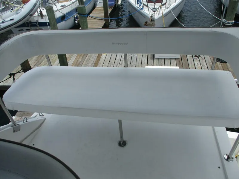 Slide: The Image of Silverton 33 Convertible 2007 boat seating area at dock. - 27