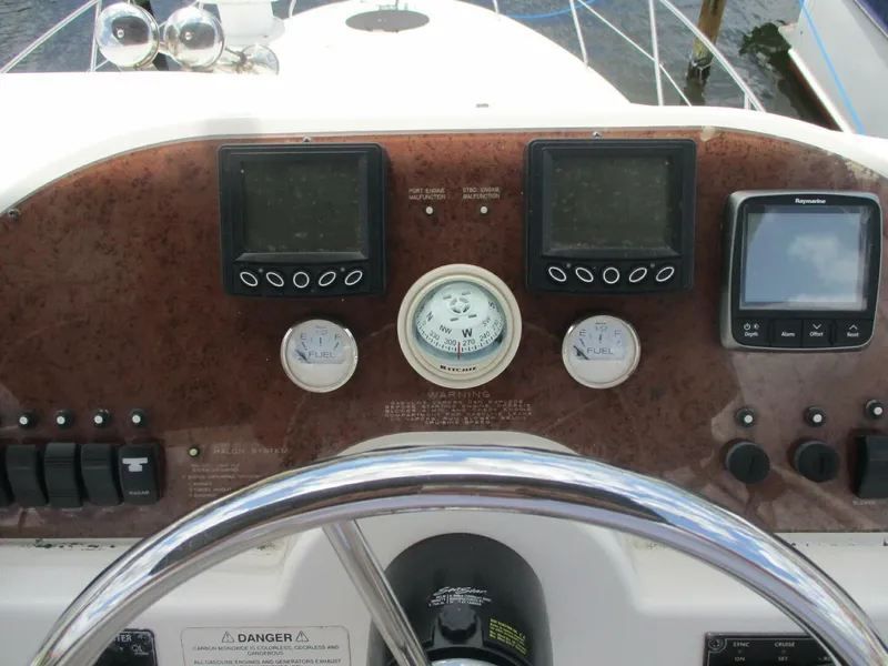 Slide: The Image of 2007 Silverton 33 Convertible helm with navigation instruments and controls. - 30