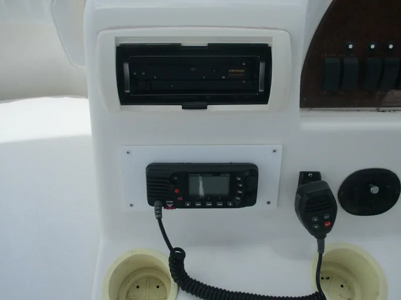 Slide: The Image of 2007 Silverton 33 Convertible boat dashboard with radio and control panel. - 31