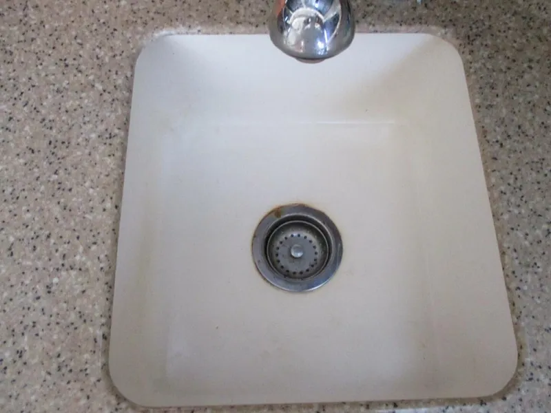 Slide: The Image of Square sink with chrome faucet in a 2007 Silverton 33 Convertible boat. - 41
