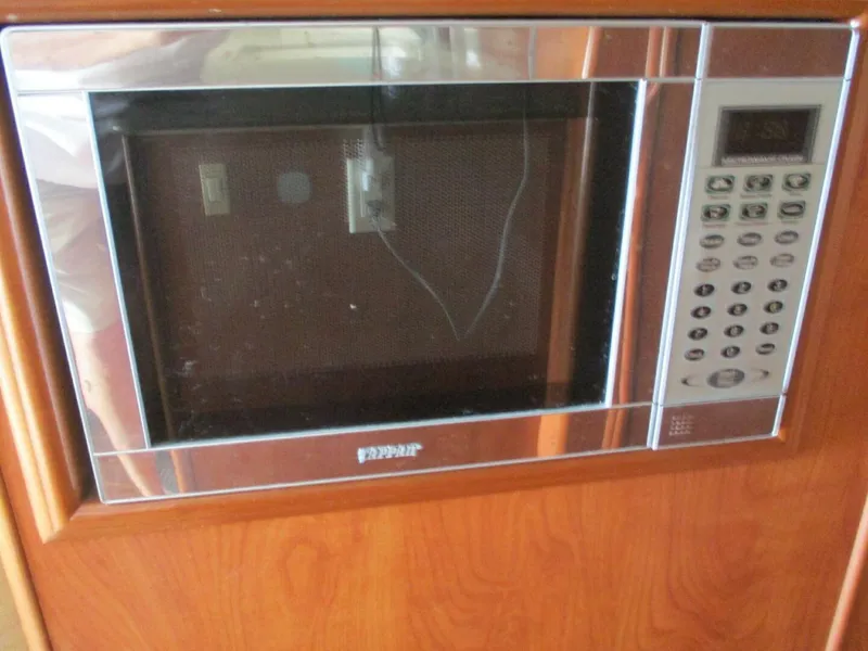 Slide: The Image of Built-in microwave in 2007 Silverton 33 Convertible yacht kitchen. - 42