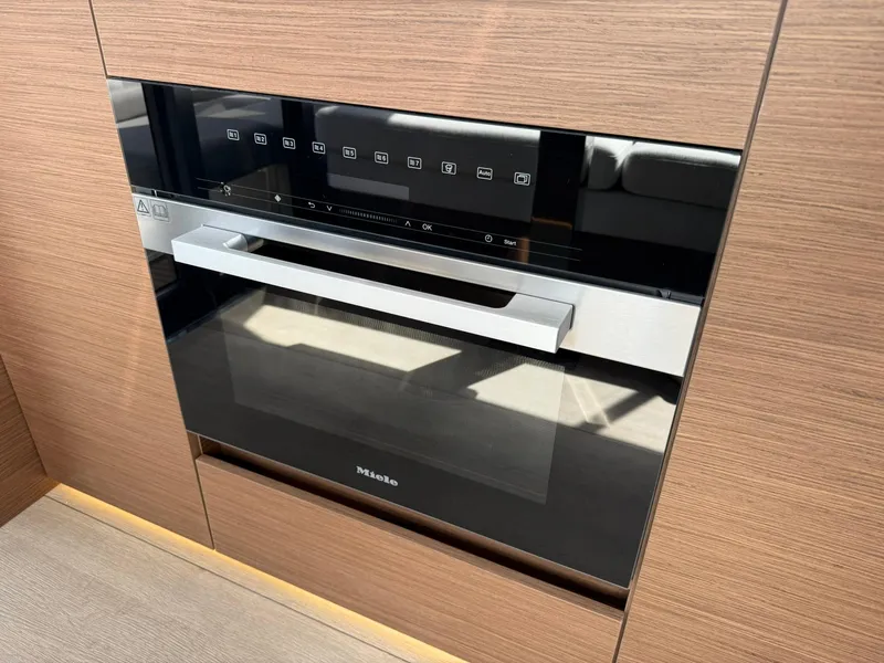 Slide: The Image of Modern built-in oven with sleek design on Wellcraft 44 Explorer yacht, 2025 model. - 15
