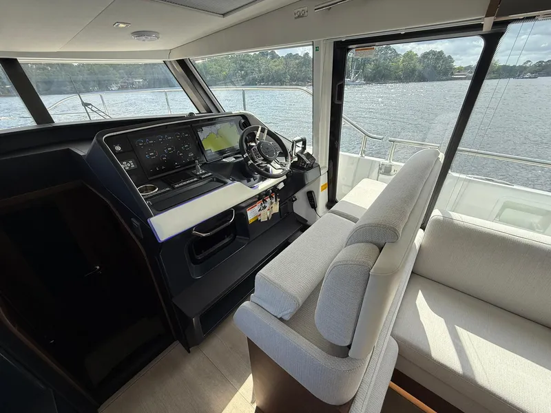 Slide: The Image of Interior of 2025 Wellcraft 44 Explorer yacht with modern helm and seating. - 23