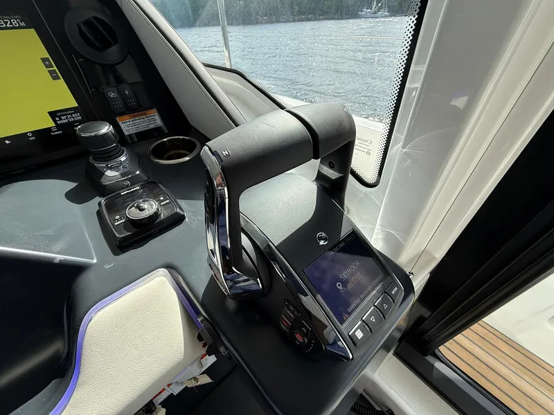 Slide: The Image of Control panel of 2025 Wellcraft 44 Explorer boat with throttle and navigation display. - 28