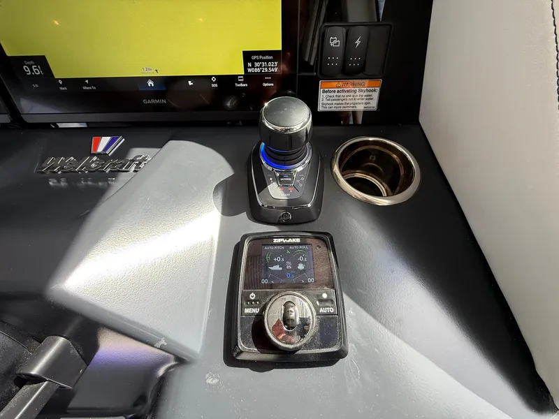Slide: The Image of Control panel of 2025 Wellcraft 44 Explorer with navigation and control knobs. - 29