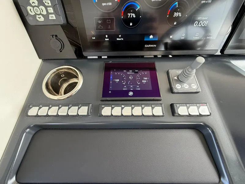 Slide: The Image of Control panel of 2025 Wellcraft 44 Explorer boat with touchscreen and joystick. - 30